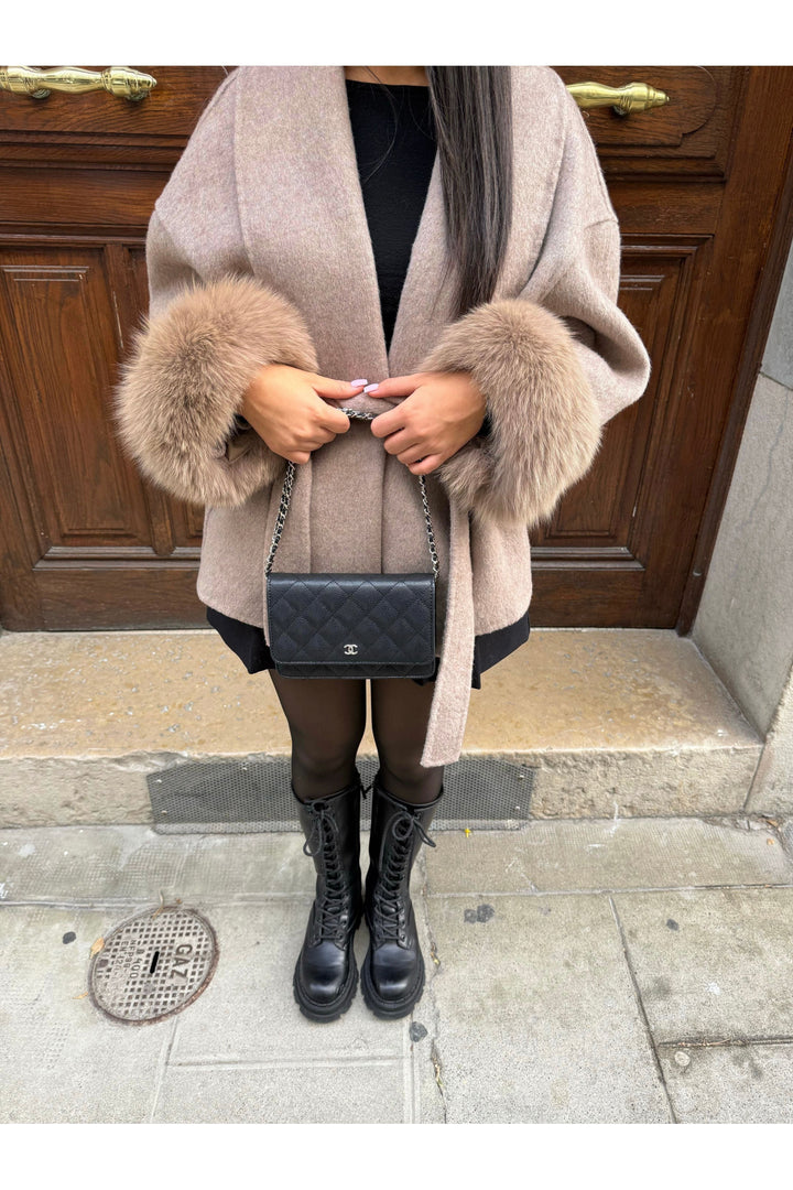 Sylvie Winter Coat featuring premium fabric, stylish faux-fur sleeves, and a long fit for ultimate warmth and elegance. - 1
