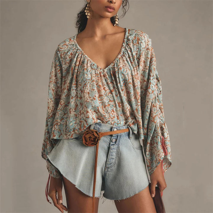 Arianna Floral Blouse featuring a puff sleeve design, made from a soft organic cotton blend, perfect for stylish and eco-friendly fashion. - 1