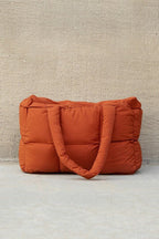 Daphne Puffer Tote featuring a durable polyester and nylon exterior with a stylish cotton lining, perfect for everyday use and trendy outings. - 12