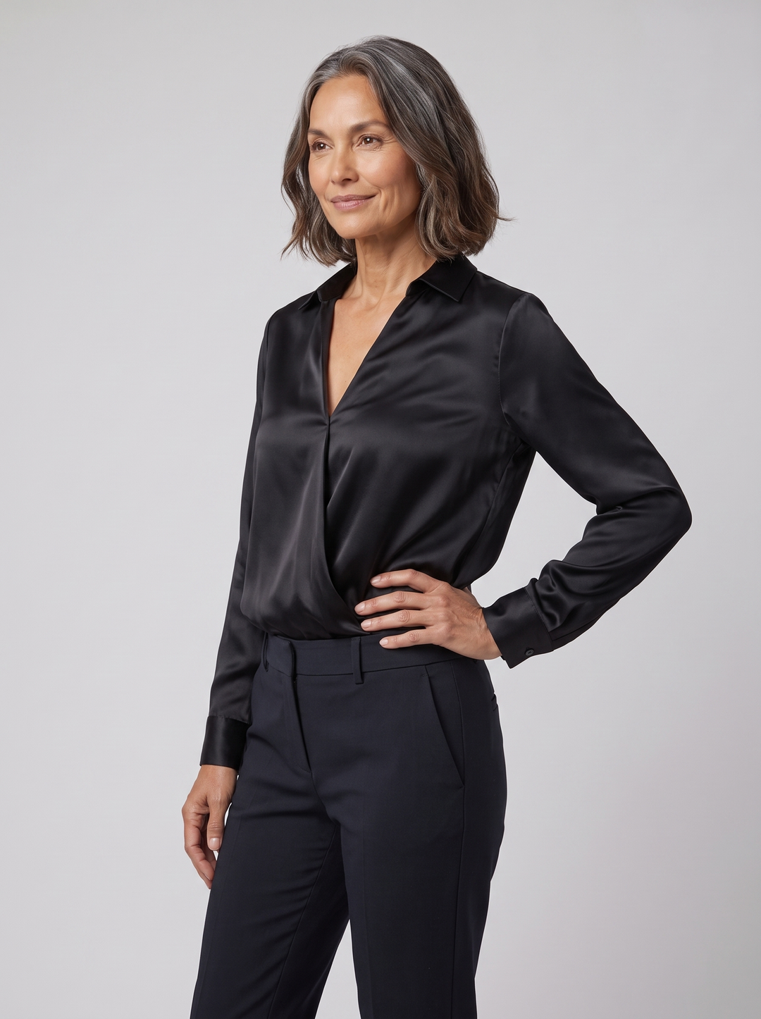 Luna black satin V-neck blouse on model