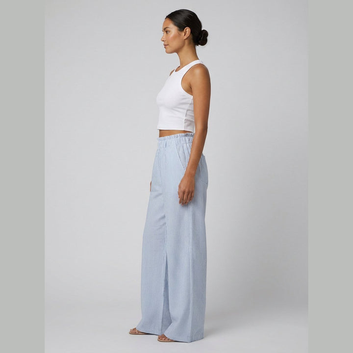 White tank and striped pants set, side view on model