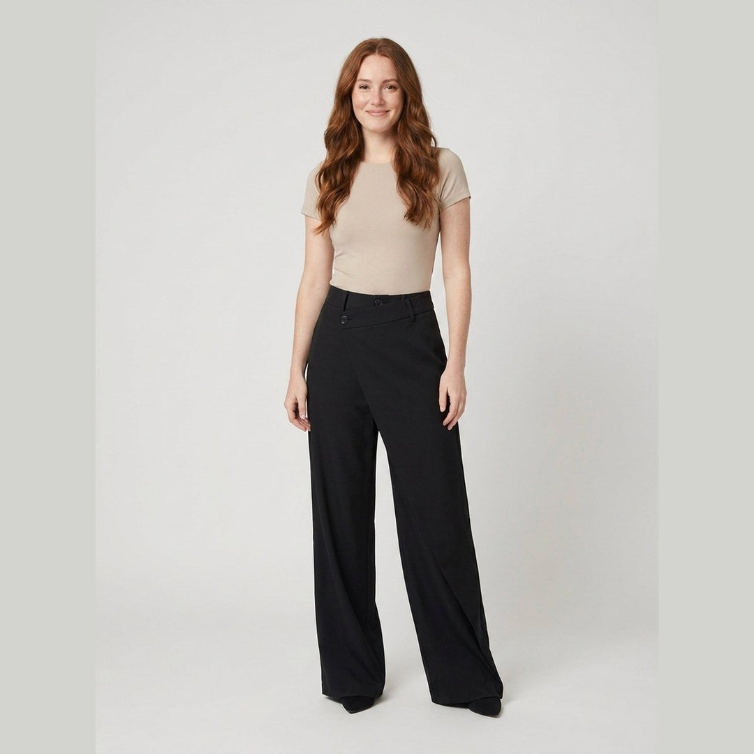 Black wide-leg dress pants with an asymmetrical front layer, front view on model