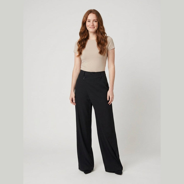 Black wide-leg dress pants with an asymmetrical front layer, front view on model