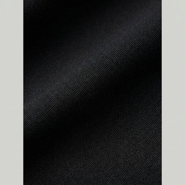 Close-up of the polyester-rayon fabric and button waist