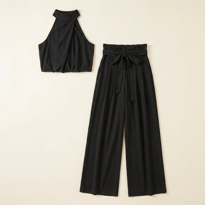 Bastienne halter crop top and high-waist pants set in black, two-piece flat-lay