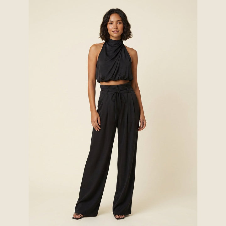 Bastienne halter crop top and high-waist pants set in black, on model