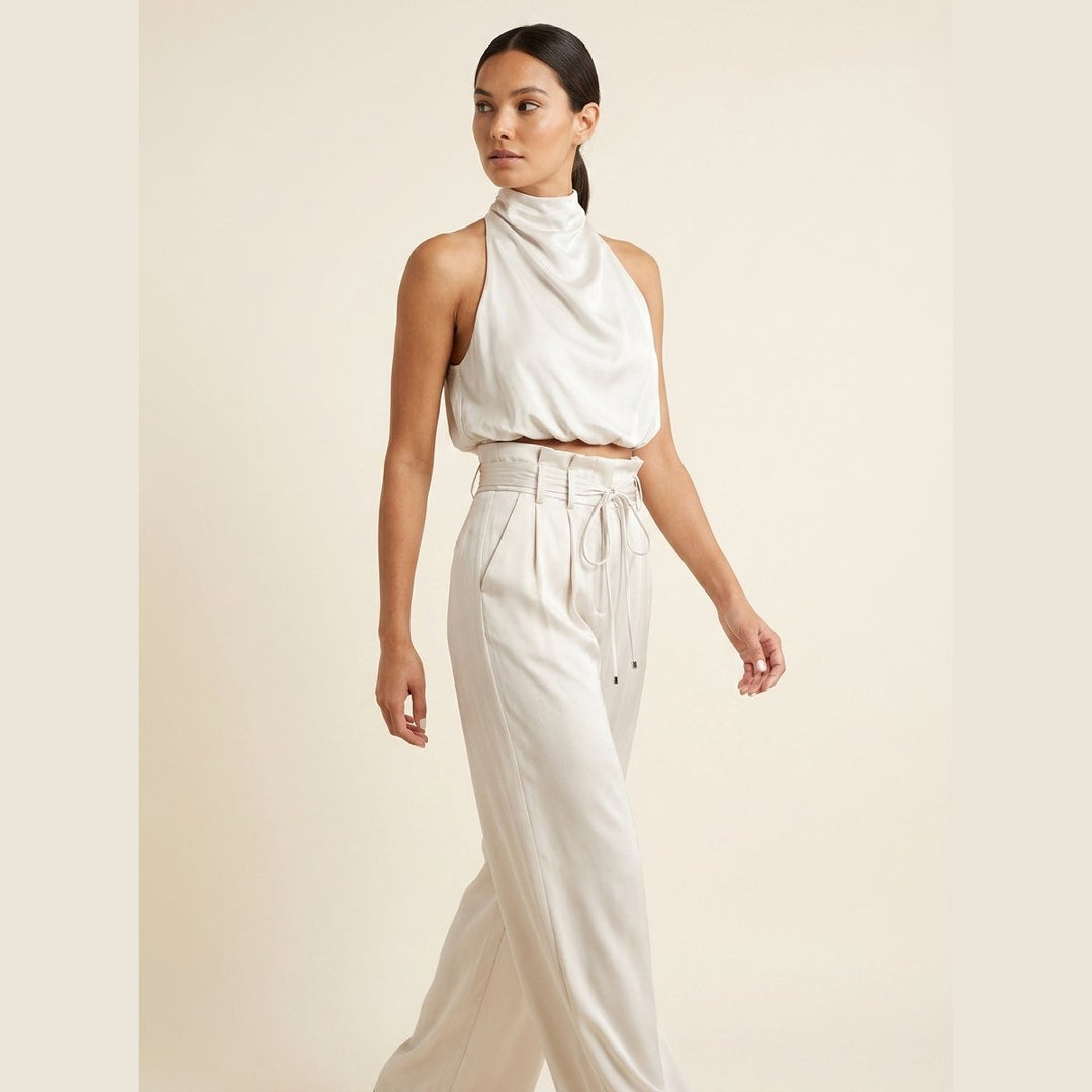 Bastienne halter crop top and high-waist pants set in white with silver, on model