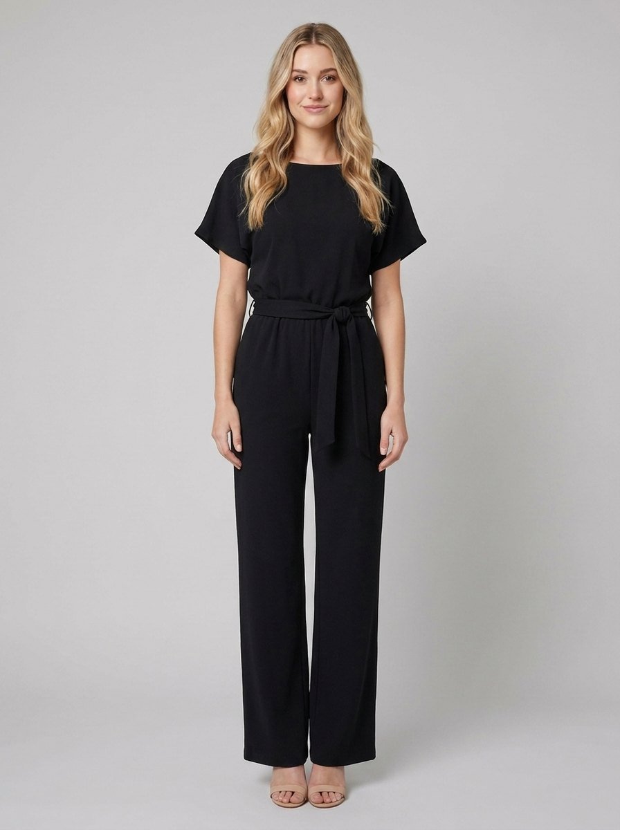 Black wide-leg jumpsuit with self-tie belt on model, front view