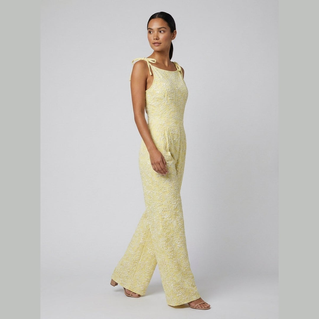 Yellow sleeveless jumpsuit, side view on model