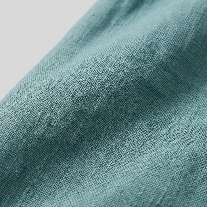 Bora teal linen fabric close-up