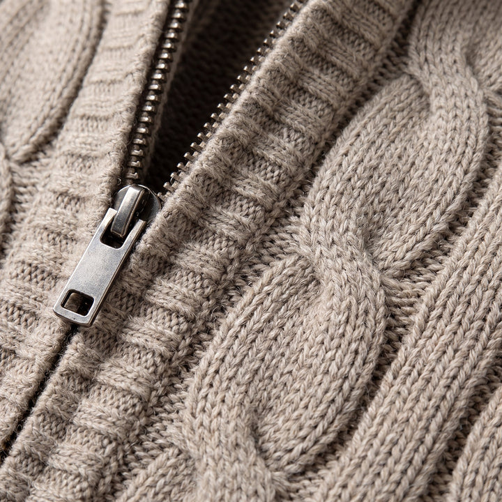 Cable knit vest fabric and zipper close-up