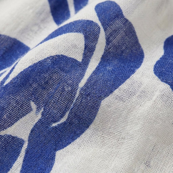 Celeste blue floral gauze fabric close-up
