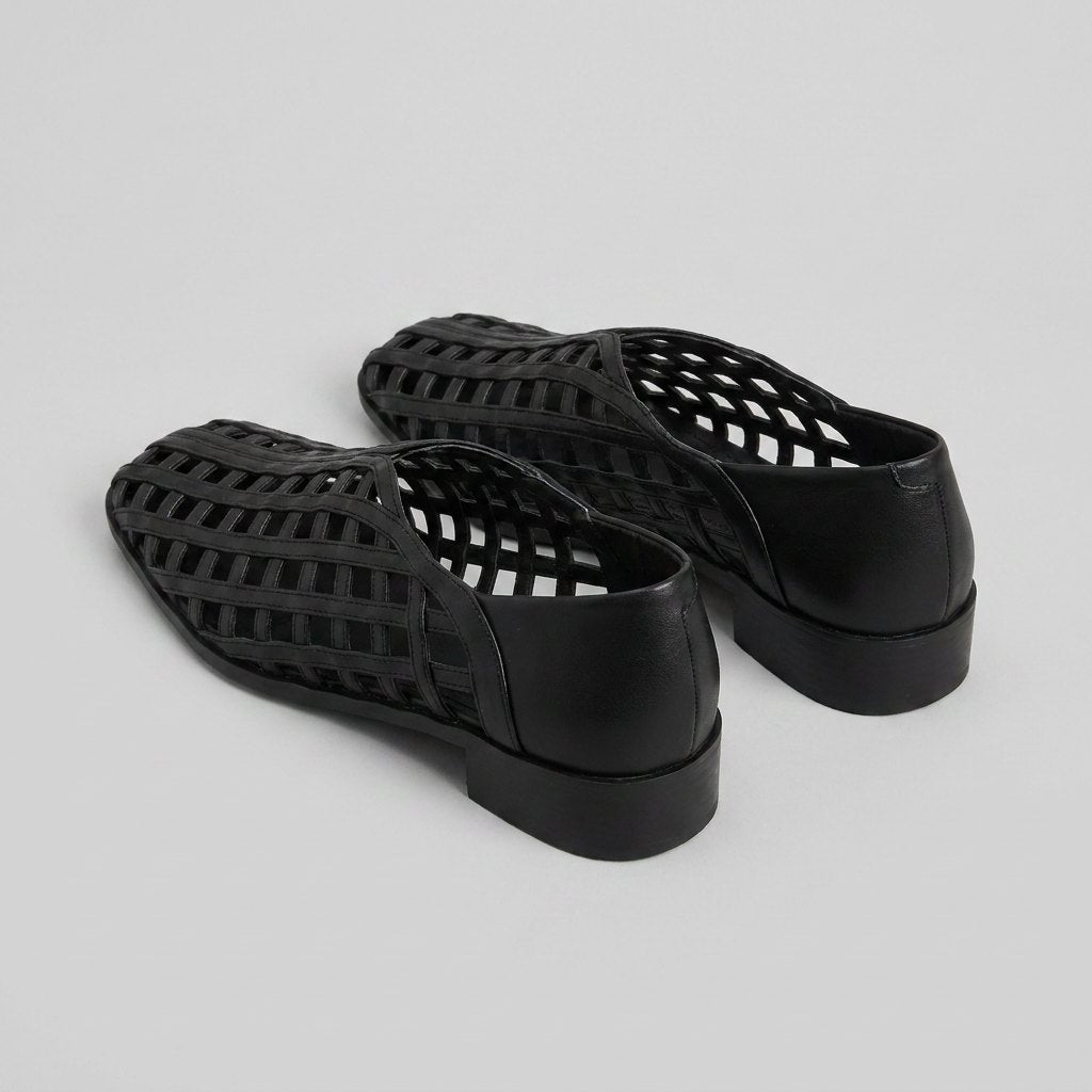 Cora black woven lattice flats, back three-quarter view