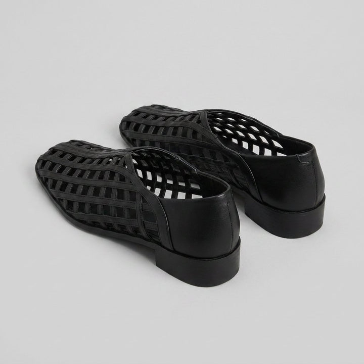 Cora black woven lattice flats, back three-quarter view