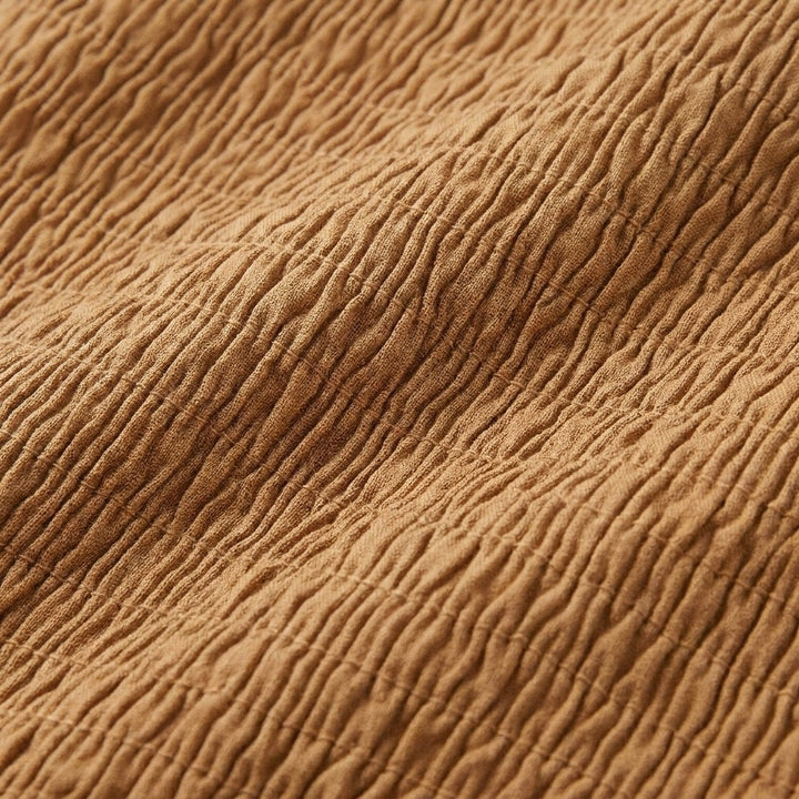Close-up of the lyocell-cotton fabric and smocking