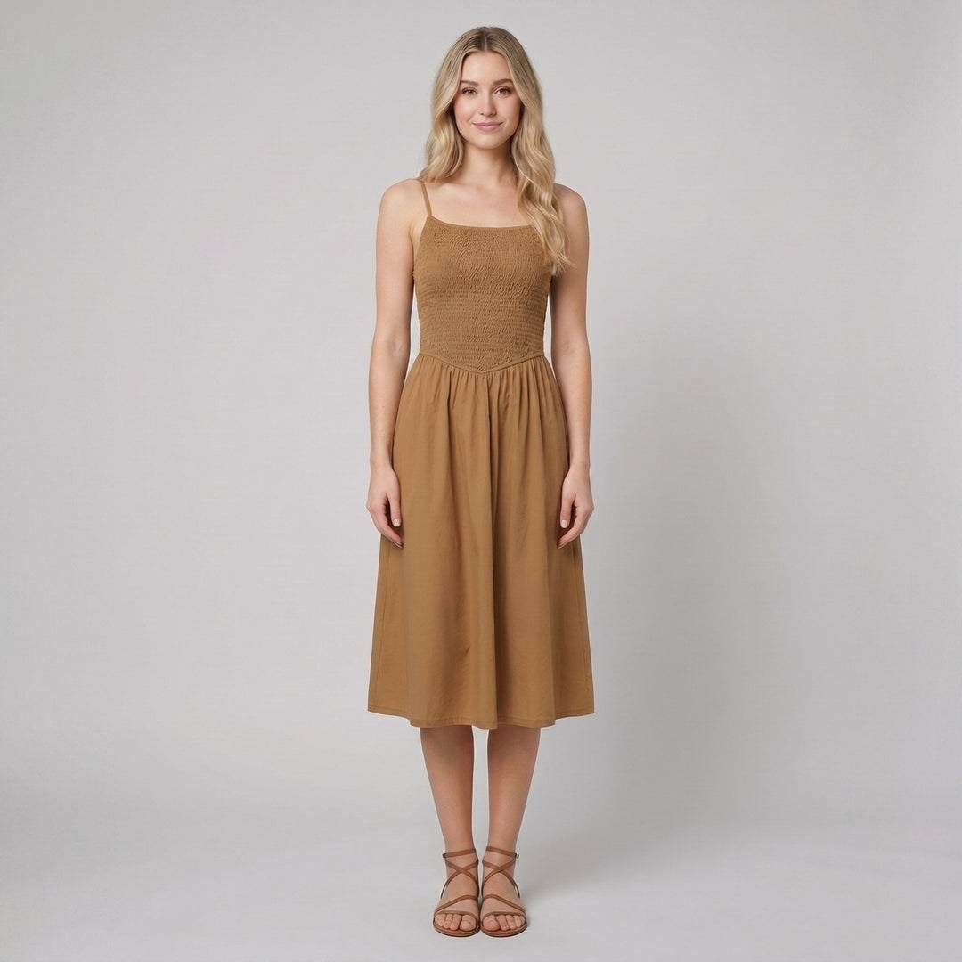 Brown A-line midi dress with a smocked bodice and spaghetti straps, front view on model