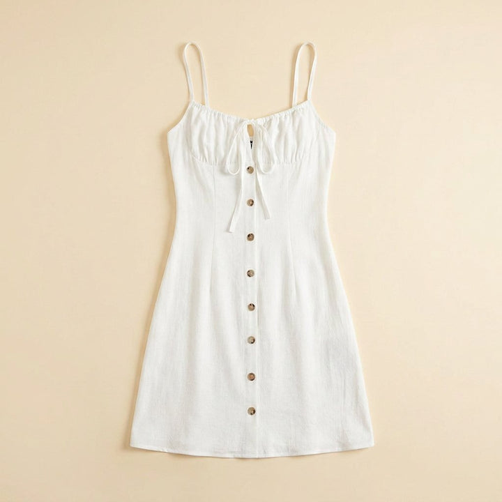 Daisy white summer dress flat lay