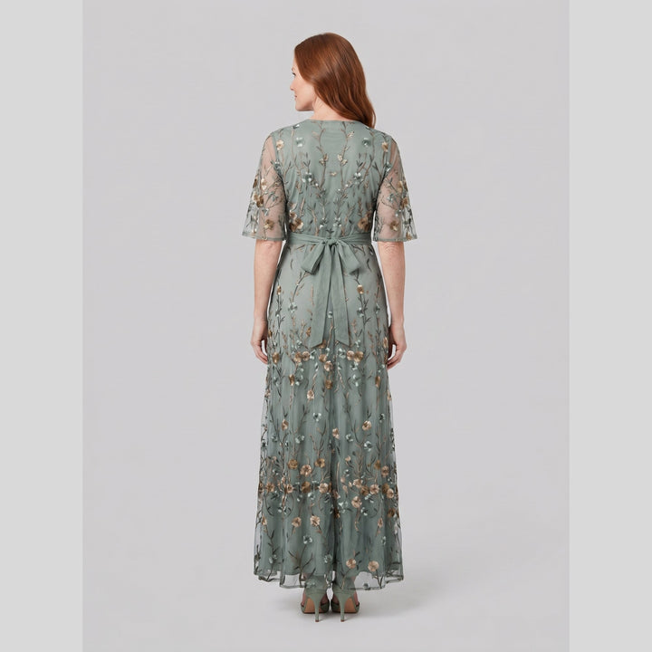 Back view of the sage green floral embroidered evening gown - The store Vancouver