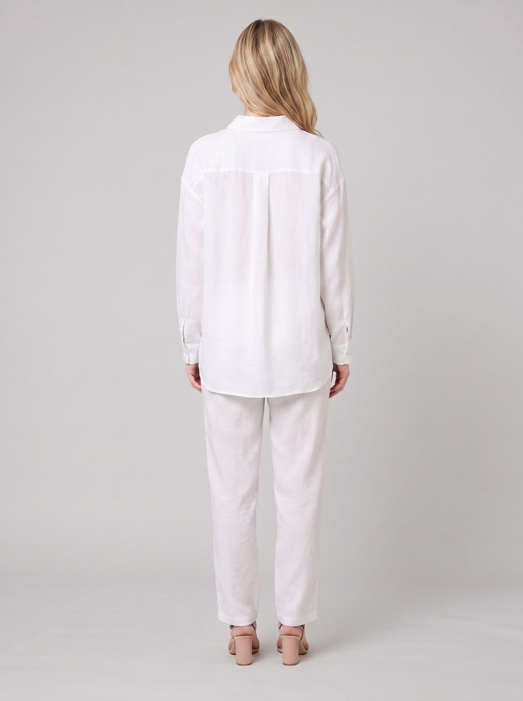 Dani white blouse back view on model