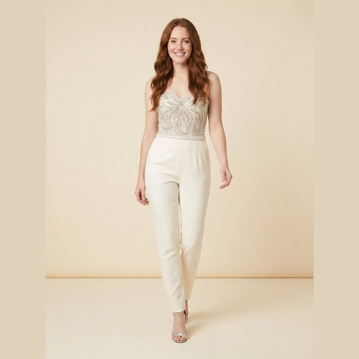 Elysian corset jumpsuit ivory walking pose on model
