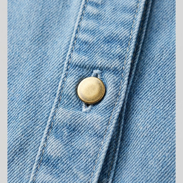 Georgina denim dress fabric and gold button close-up