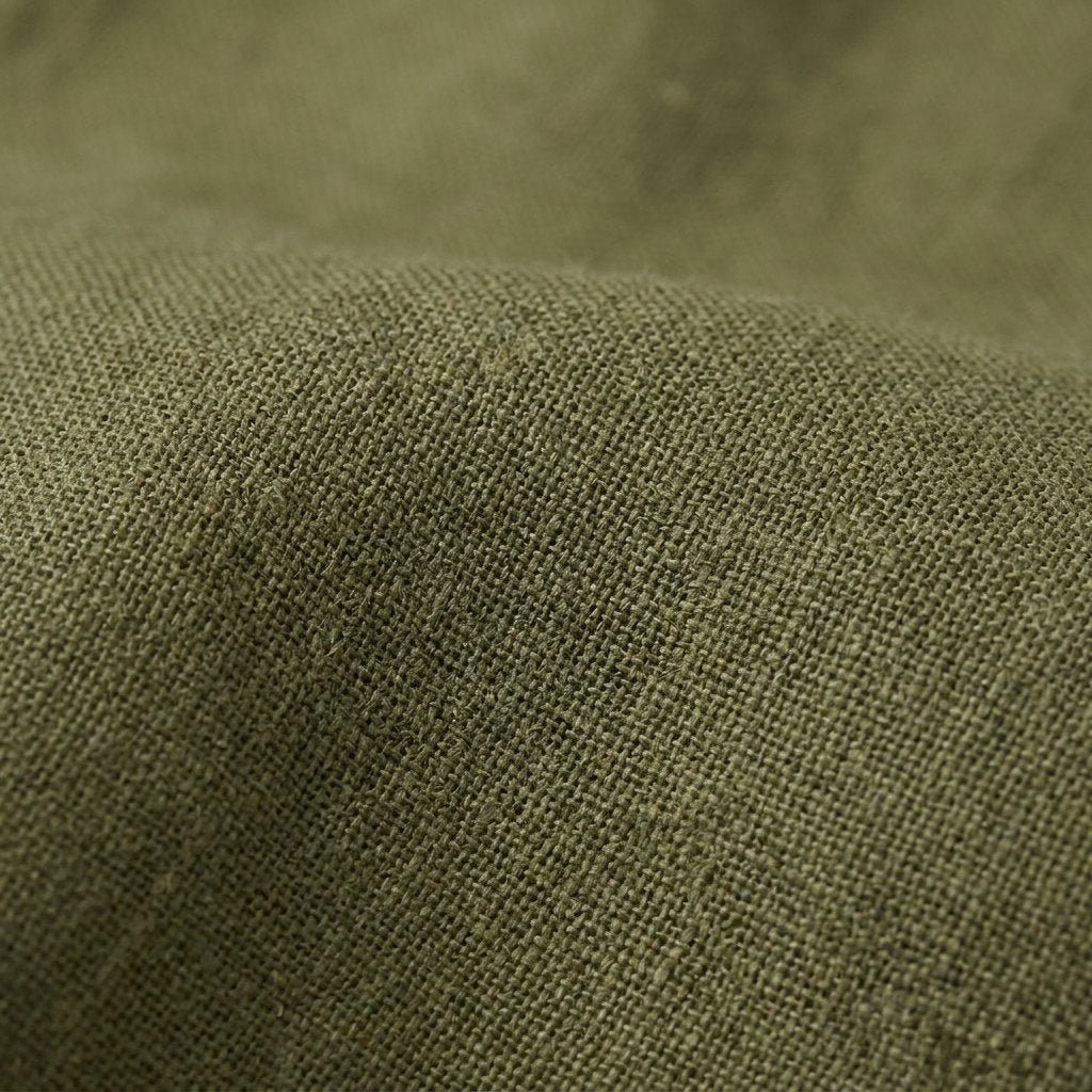 Gina green linen midi dress fabric close-up
