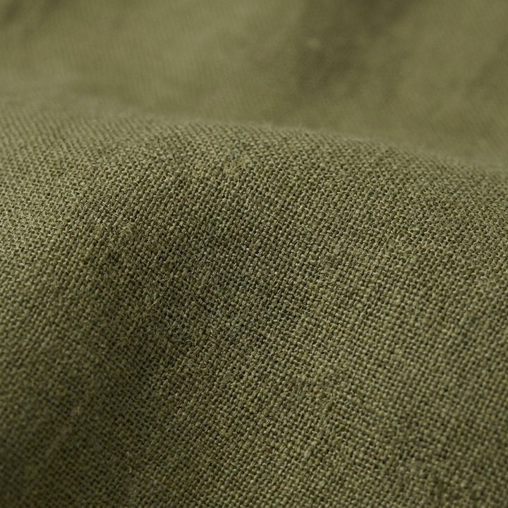 Gina green linen midi dress fabric close-up