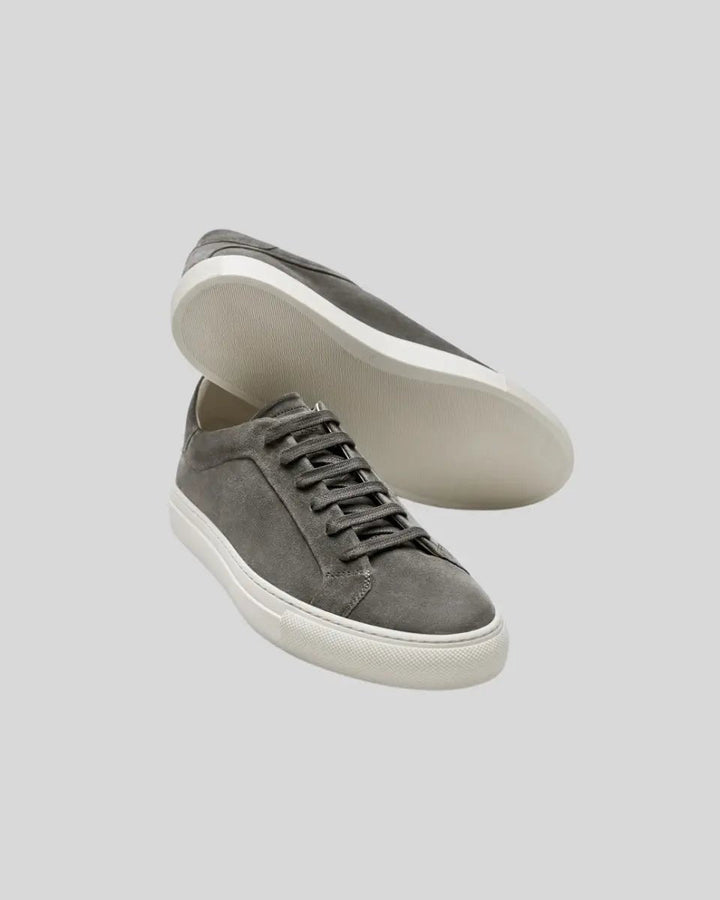 Halden Oxford sneakers in dark grey leather, angled view showing the closed-throat lacing