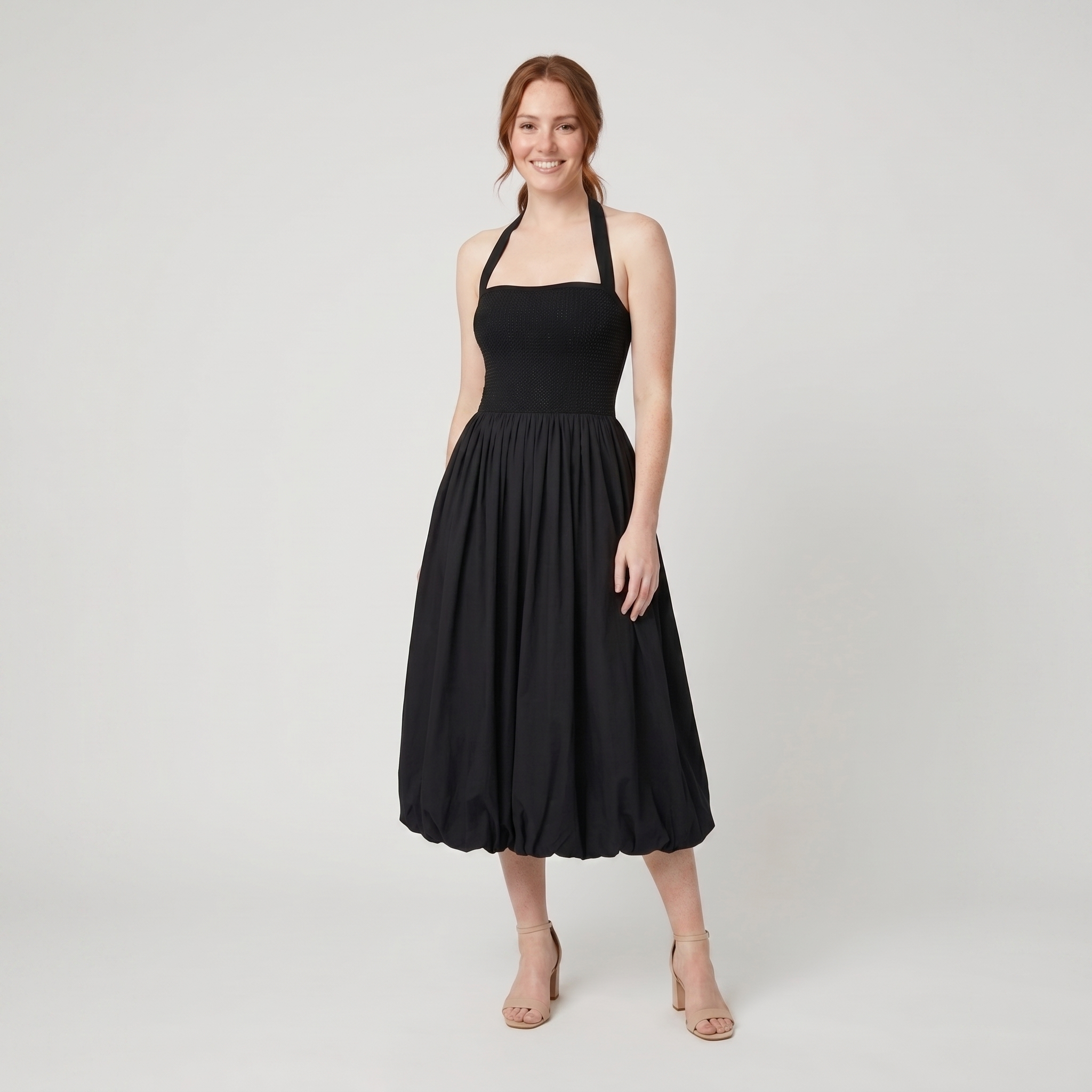Haven black halter bubble-hem knit midi dress on model