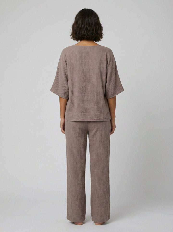 Taupe batwing sleeve top and ankle pants, back view on model