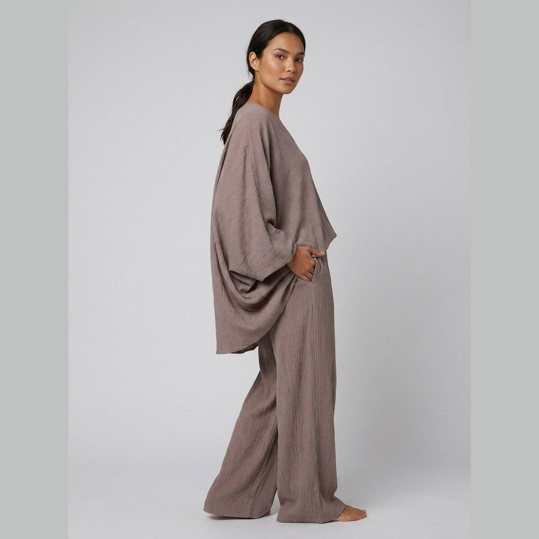 Taupe batwing sleeve top and ankle pants, side view on model