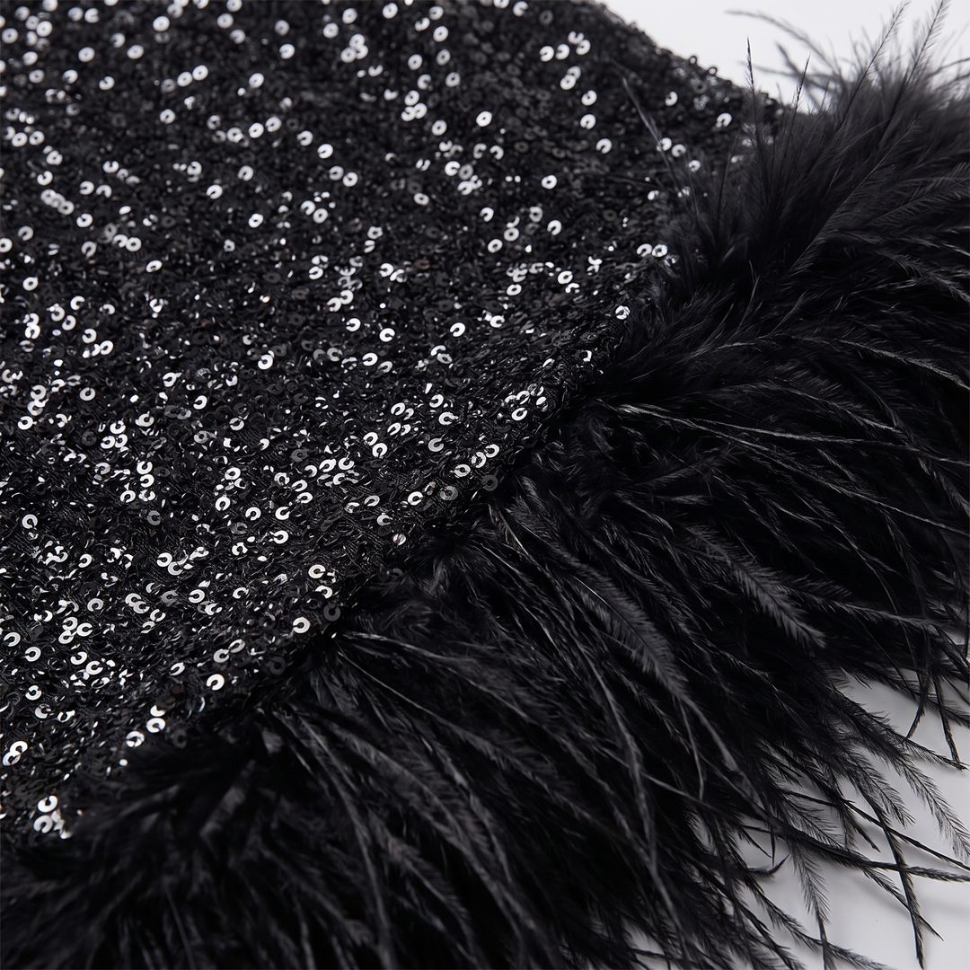 Close-up of black sequins and the feather hem trim