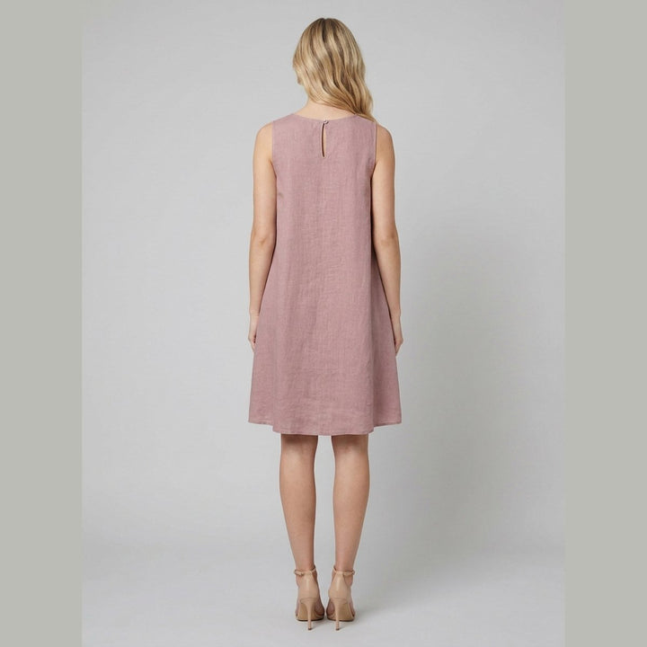 Mauve linen dress, back view with coconut button closure