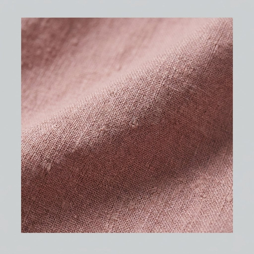 Close-up of the lightweight linen weave in mauve