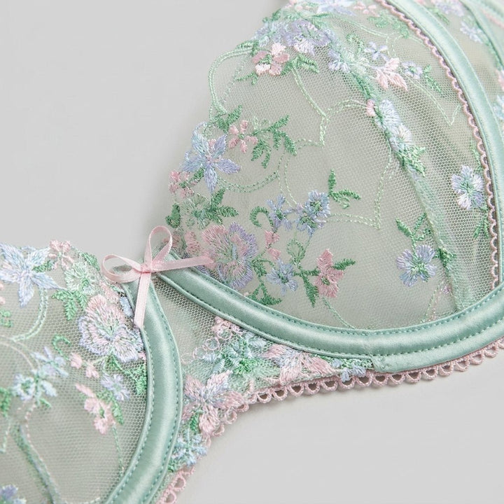 Close-up of the heart-themed floral embroidery on satin