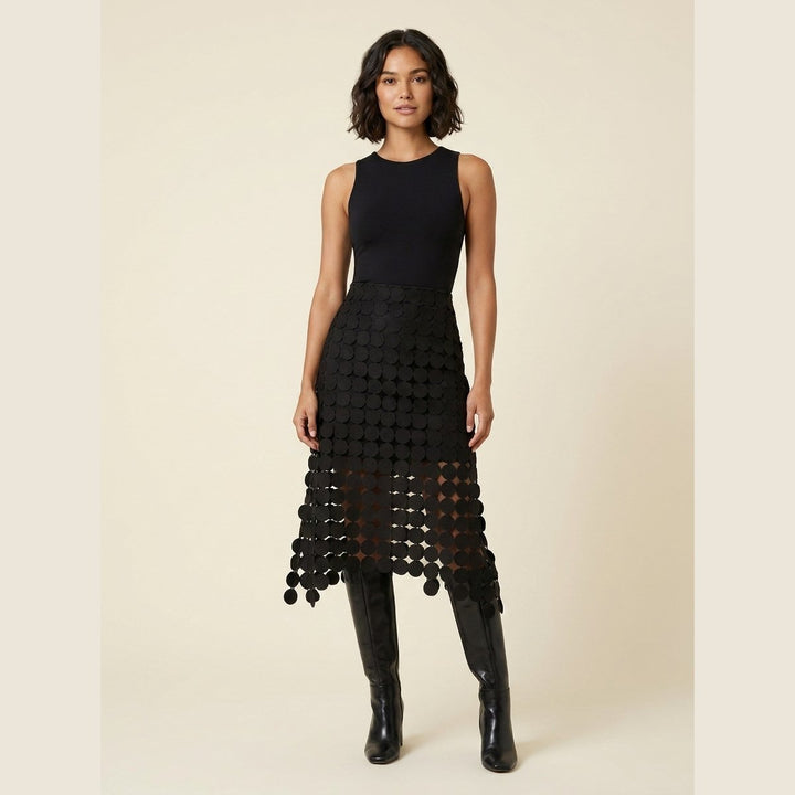 Luna black laser-cut disc high-waist midi skirt, front view on model