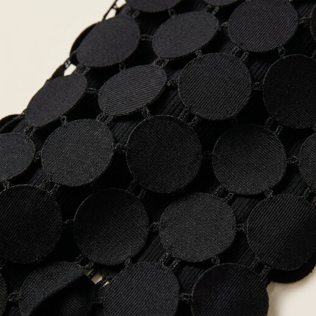 Luna midi skirt laser-cut disc fabric close-up