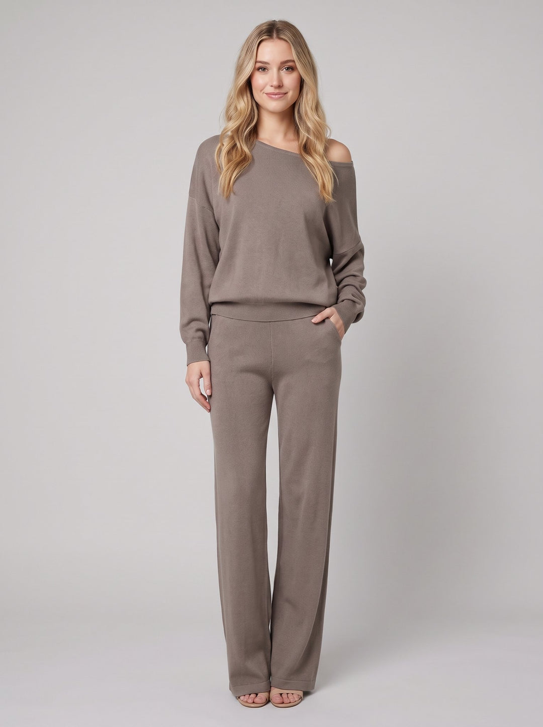 Luxe Eleganza loungewear set in camel taupe, off-shoulder knit sweater and wide-leg pants, front view on model
