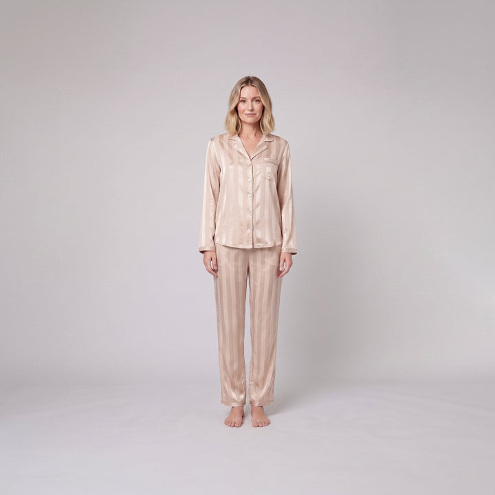 Luxe satin pajama set in champagne beige, front view on model