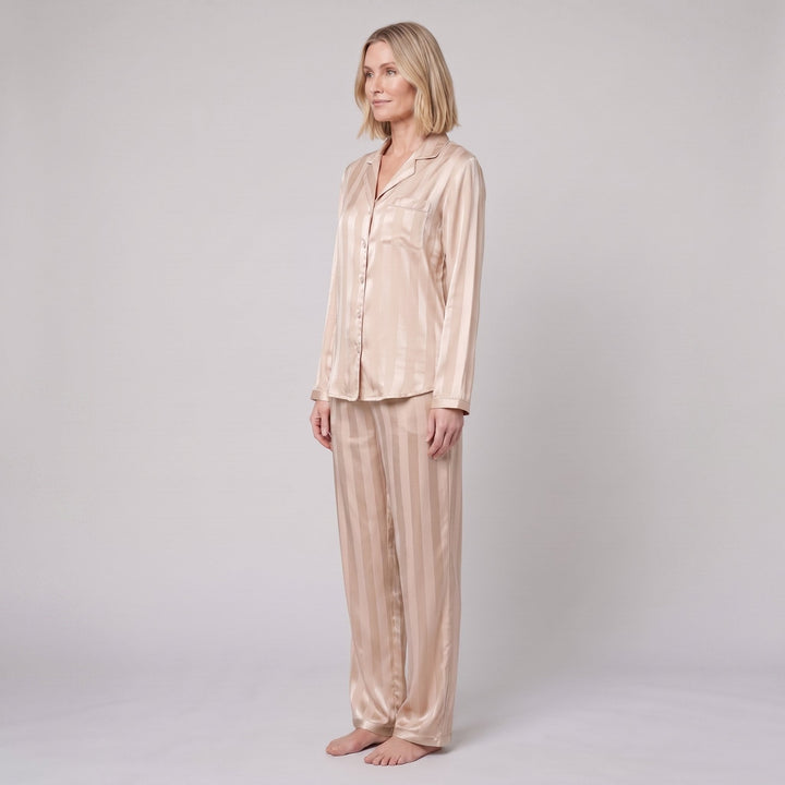 Luxe satin pajama set in champagne beige, side view on model