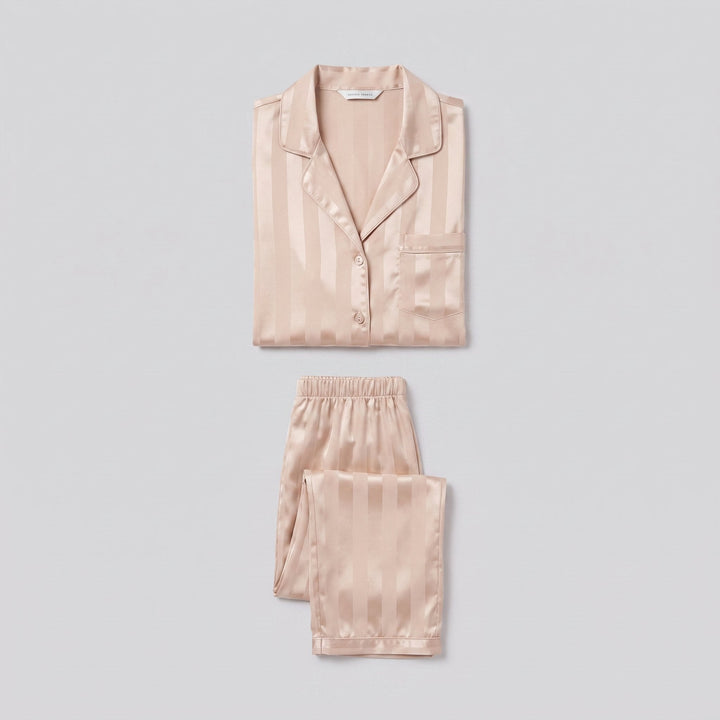 Luxe satin pajama set in champagne beige, two-piece flat-lay
