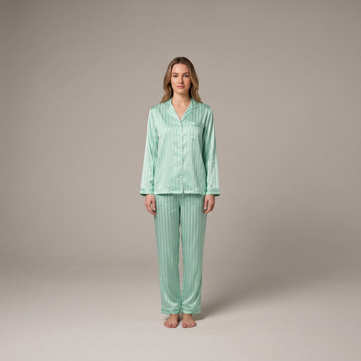 Luxe satin pajama set in sage green, front view on model