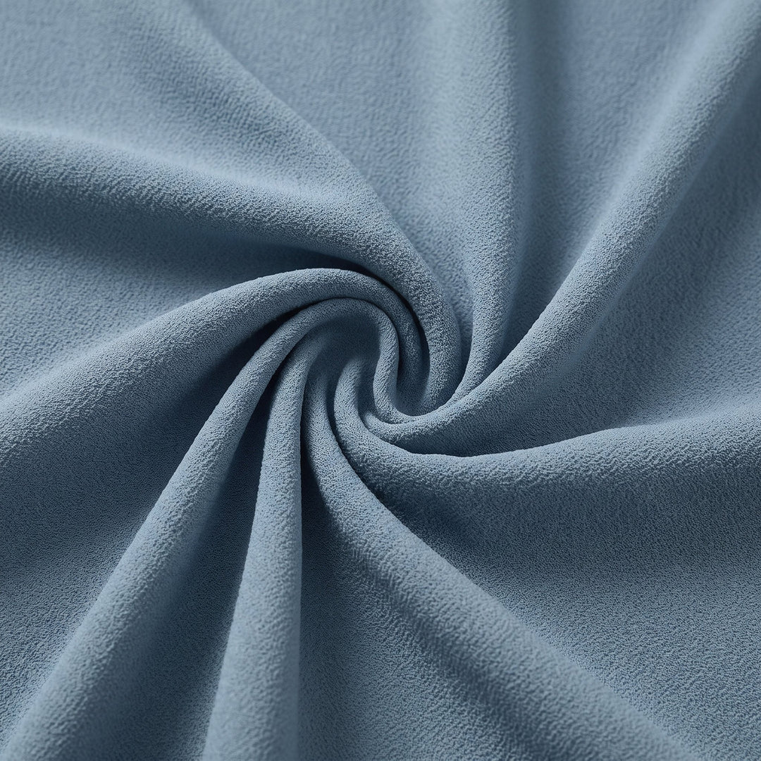 Lyra draped knot jumpsuit crepe fabric close-up in dusty blue