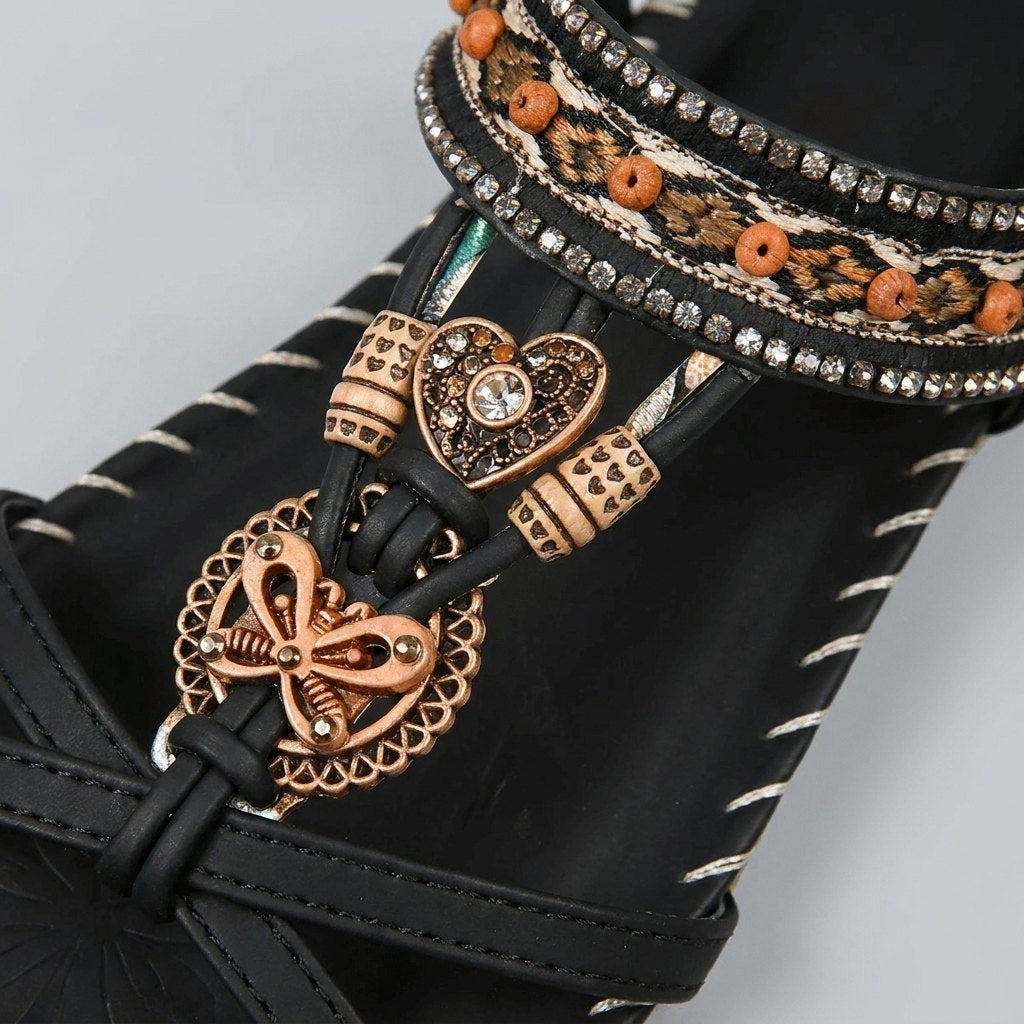 Close-up of the beaded band across the toes of the sandal