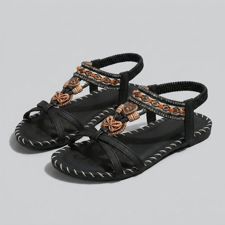 Black beaded flat sandal with elastic heel strap, front view