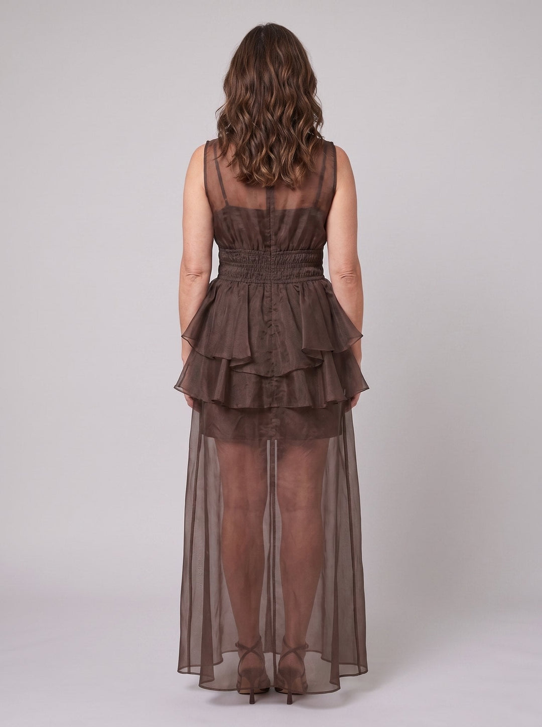 Chocolate one-shoulder maxi dress, back view showing the elastic panels