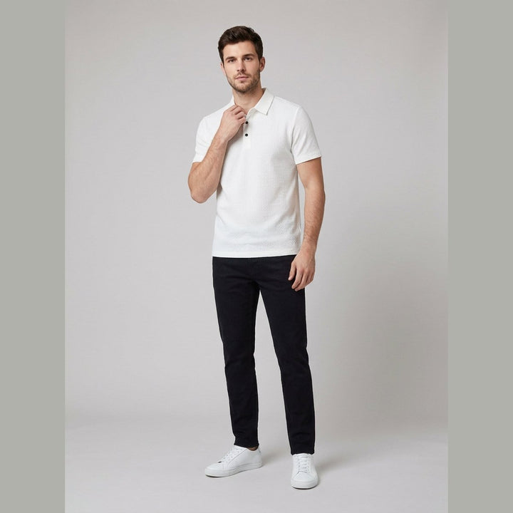 White short-sleeved golf polo shirt, front view on model