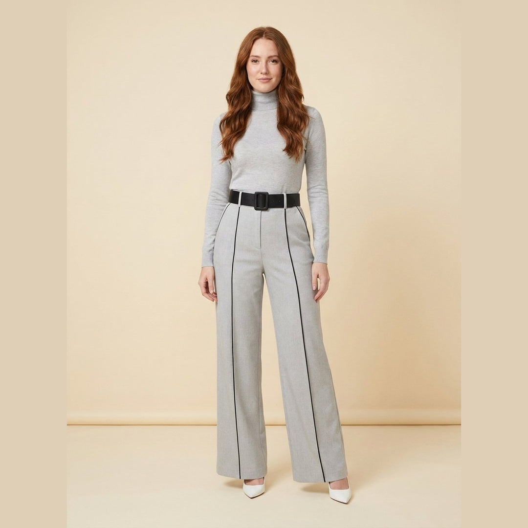 Mila grey tailored knit jumpsuit with black piping and belt, front view on model