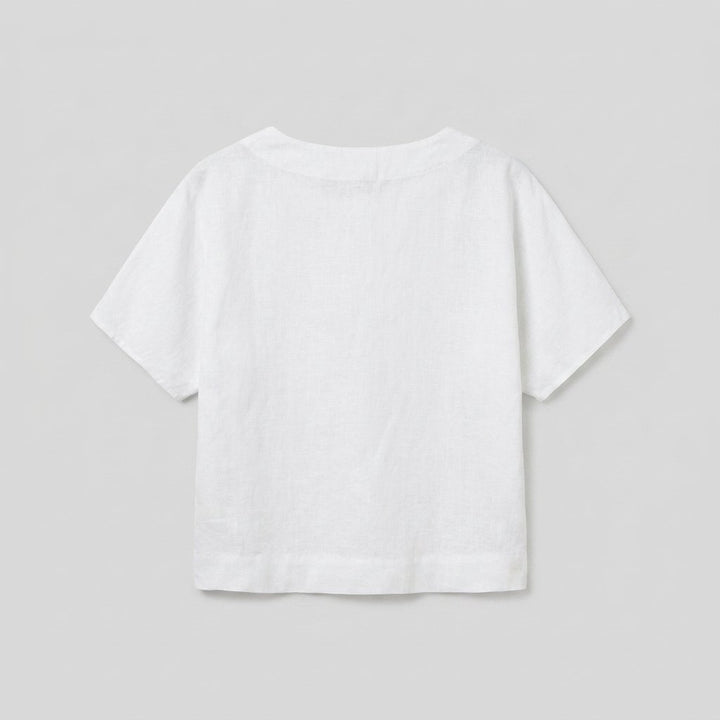 Mira white linen top back flat lay