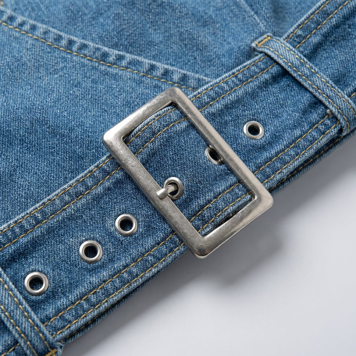 Close-up of the blue denim fabric and gathered waist detail
